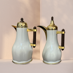A golden white tea and coffee thermos set with a dark brown wooden handle
