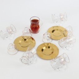 Glass tea and coffee serving set with gold stainless steel saucers – 18 pieces Glass tea and coffee serving set with gold stainless steel saucers – 18 pieces