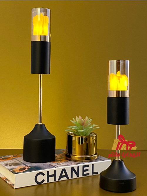 Gold / black candlestick with a round base
