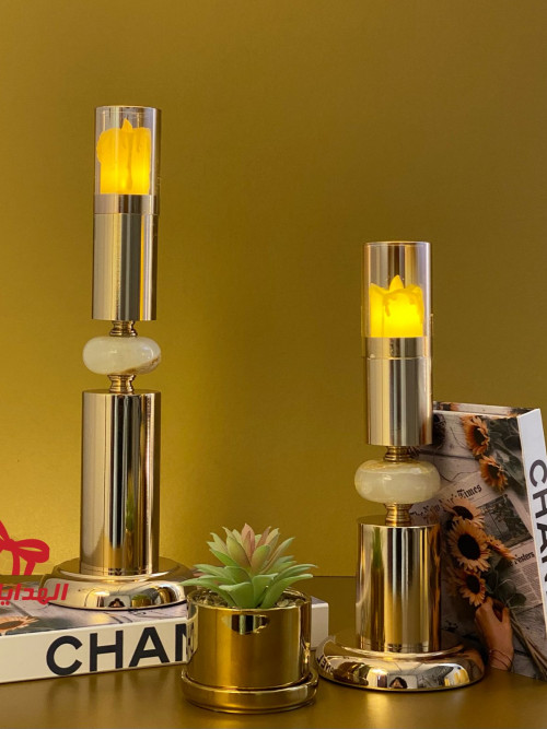 Gold candlestick with a round base