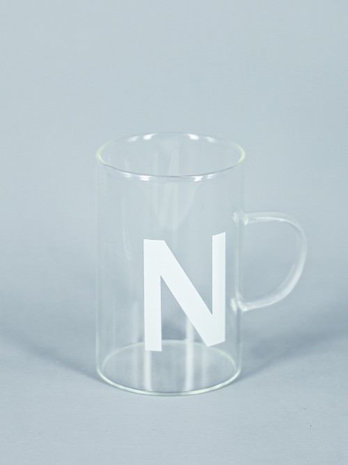 Clear glass mug with black handle