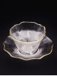 Clear glass cup with golden rim