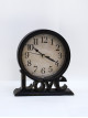 Round wall clock with a black frame, size 21 * 17 cm
