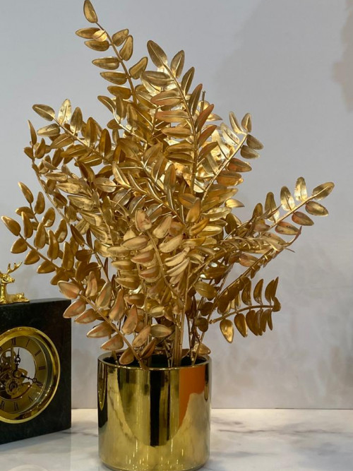 Golden ornamental tree corner with golden pot