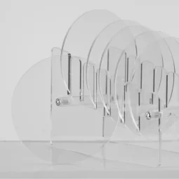 A set of 6 transparent cup coasters with a transparent stand